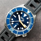 Armida A1 42mm steel blue sunray orange minute sapphire bezel.